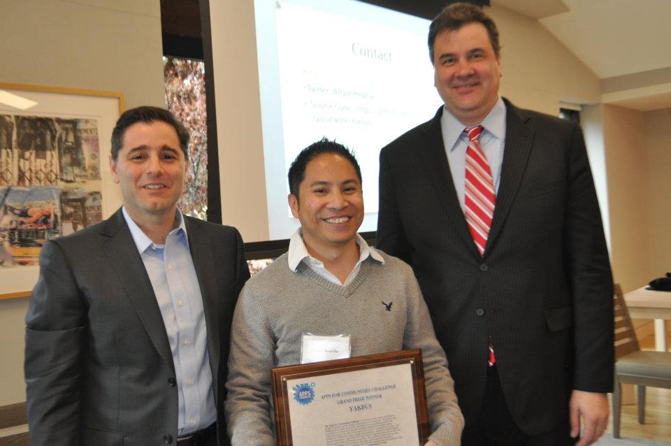 FCC Chairman Julius Genachowski with grand prize winner Ryan Resella and The Knight Foundation National Program Director Damian Thorman - Flickr - Knight Foundation.jpg