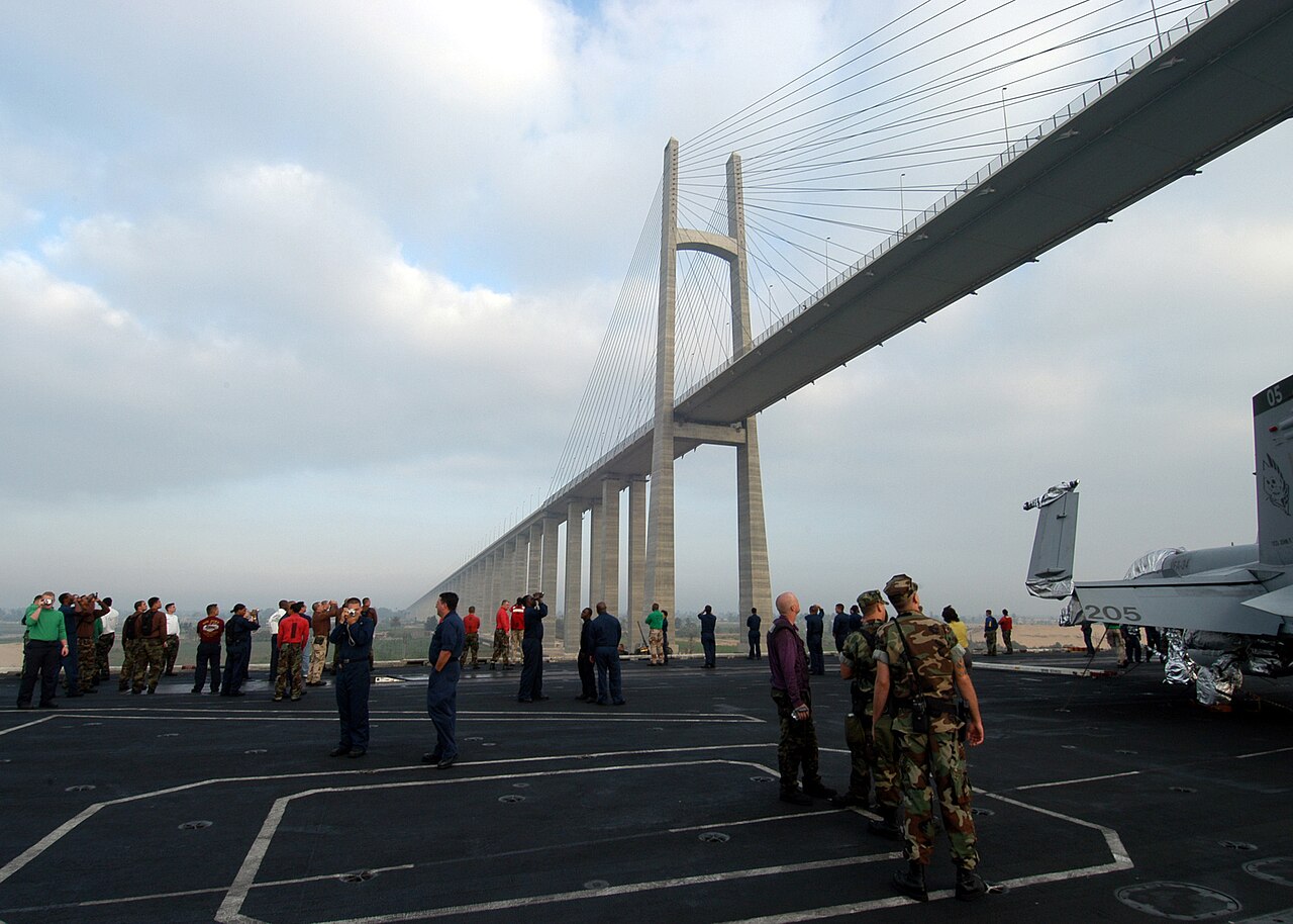 US Navy 040703-N-4190W-002 Sailors aboard the conventionally powered aircraft carrier USS John F. Kennedy (CV 67) take a moment to observe the Morass Bridge that links Egypt and Saudi Arabia over the Suez Canal.jpg