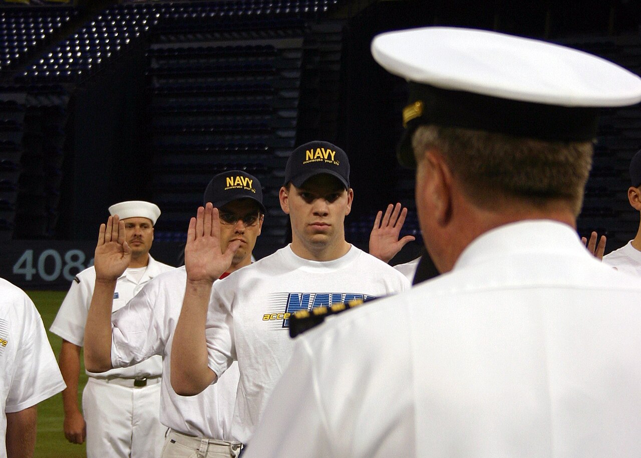 US Navy 050928-N-7163S-002 Members assigned to the Delayed Entry Program takes the Navy's oath of enlistment at the Minnesota Twins and Kansas City Royals Major League Baseball game.jpg