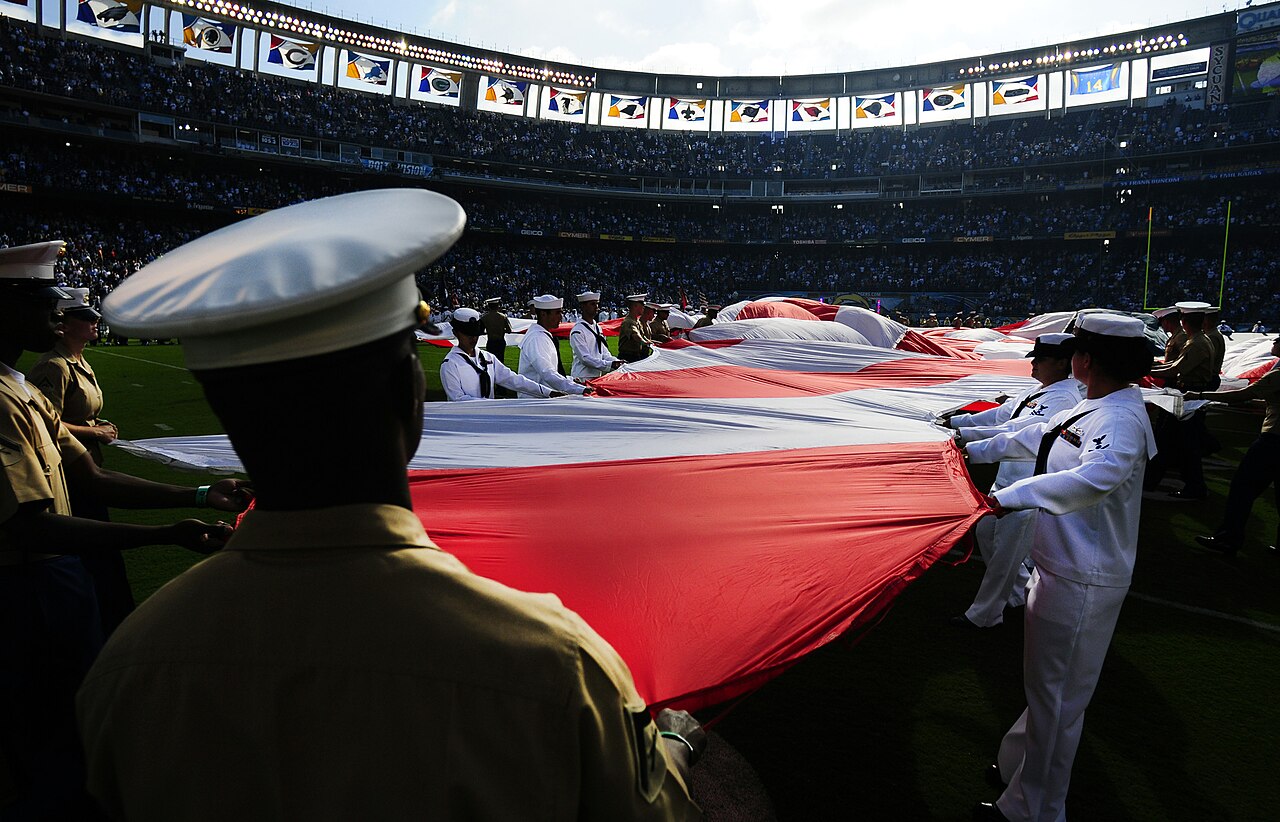 Flickr - Official U.S. Navy Imagery - Sailors and Marines prepare to spread the American flag across the field during a preseason NFL game.jpg